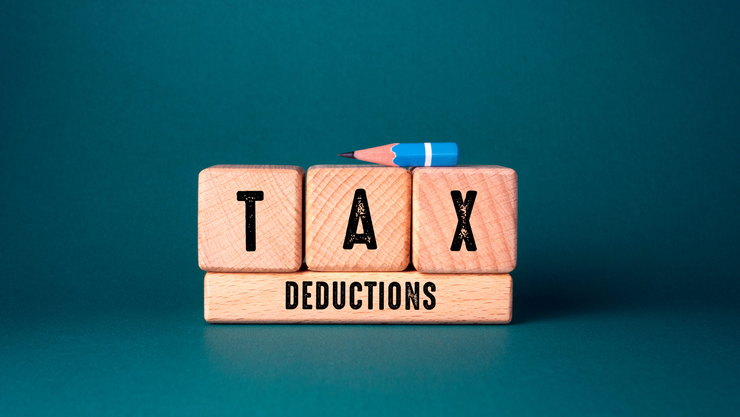A taxpayer reviewing how deductions reduce taxable income versus a tax credit that reduces their tax bill directly.