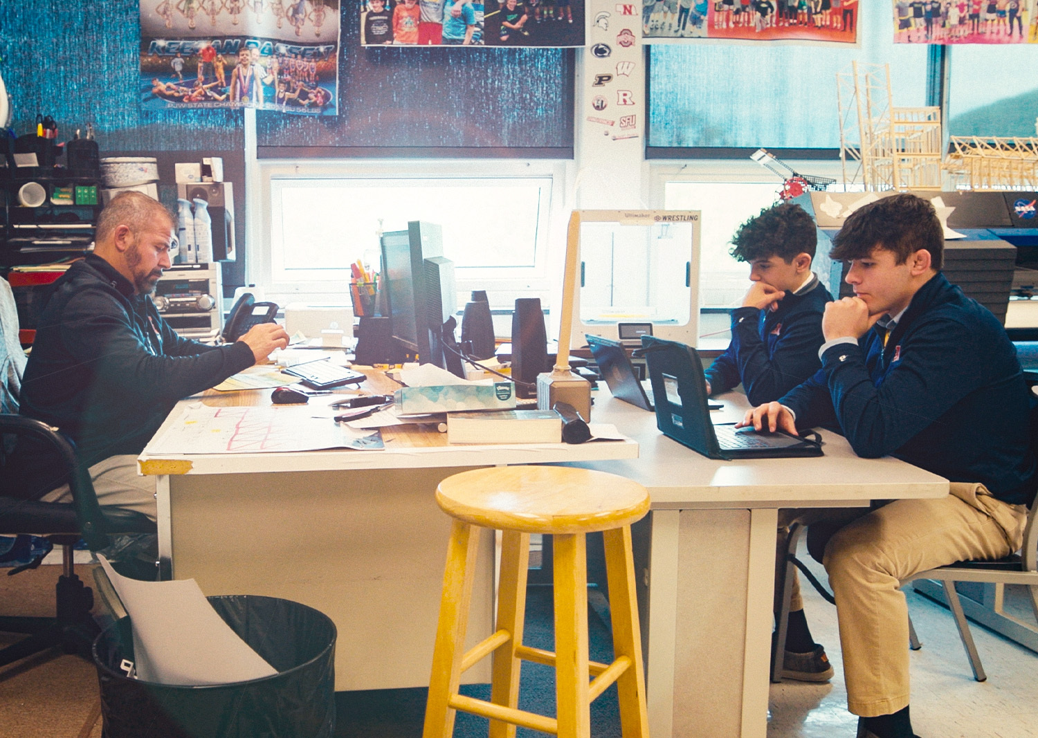 Bo Bassett competing on the wrestling mat, the sport that defined his journey to Bishop McCort High School.