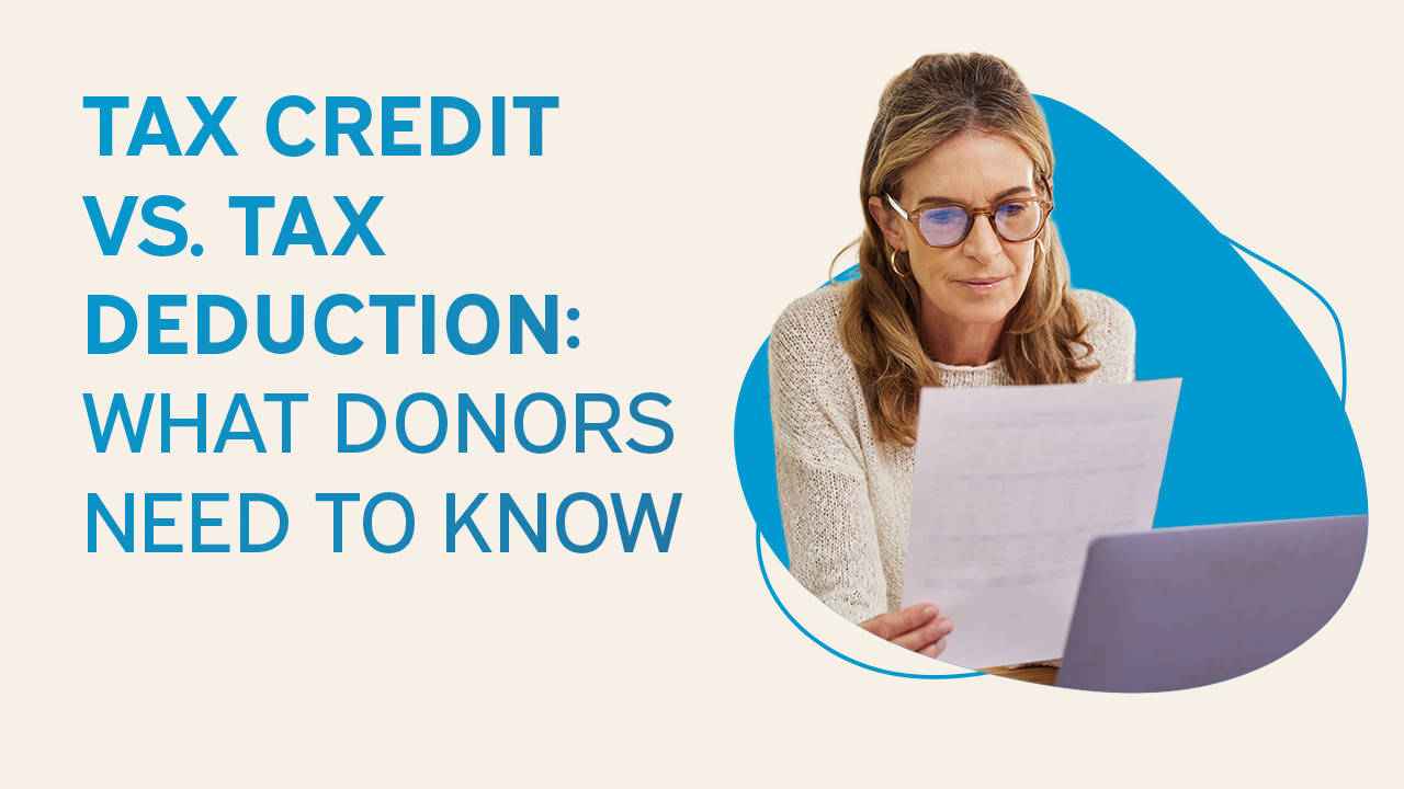 Graphic reading “Tax Credit vs. Tax Deduction: What Donors Need to Know” with a woman reviewing financial documents on a laptop.