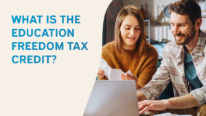 Graphic reading “What Is the Education Freedom Tax Credit?” with a couple reviewing financial documents on a laptop.