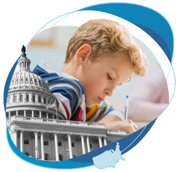 A student writing at a desk beside the U.S. Capitol